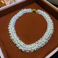 Detailed macro view of a vintage-style hand-woven pearl necklace with gold bead accents. - Necklace / Choker Necklace / Gold White