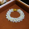 Close-up of an elegant French retro pearl beaded bracelet with a vintage golden clasp - Bracelet / 19x2cm / Gold White