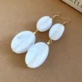 Elegant white marbled acrylic drop earrings with gold finish earring hooks. - Earring Hooks / White