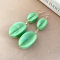 Elegant light green marbled acrylic dangle earrings with golden metal hooks for women - Earring Hooks / Green