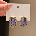Macro view of vintage gold earrings featuring micropave blue zircons on 316L card - Rectangle Array Style (17#)