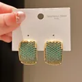 Detail view of vintage green pavé zircon earrings on a 316L stainless steel card - Rectangle Curved Surface Pavé Style (18#)
