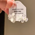 Close-up detail of vintage-style silver flower earrings featuring sparkling zircon stones - Zirconia Flower Drop Style (20#)