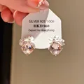 Detailed macro view of elegant crystal flower stud earrings with 925 silver export tag - Double Pink Zirconia Flower Cluster Style (25#)