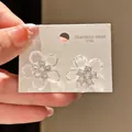Close-up detail of vintage crystal flower earrings with sparkling zircon centers - Transparent Petal Zirconia Style (26#)