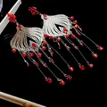 Exquisite vintage ethnic style silver tassel earrings with sparkling red crystal droplets. - Red
