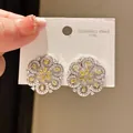 Vintage stainless steel silver flower stud earrings with yellow and clear zircon stones - Hollow Petal Zirconia Style (48#)
