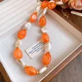 Vintage retro acrylic beaded necklace with orange and white oval stones in jewelry box - Necklace / Orange