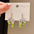 Elegant 316L stainless steel drop earrings featuring clear zirconia leaves and green beads. - Double Leaf Zirconia Green Bead Style (56#)