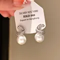 Elegant 925 silver stud earrings with zirconia swirl design and lustrous white pearls - Spiral Curve Pearl Style (58#)