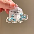 Elegant vintage silver flower stud earrings with blue crystals on white card - Clover Blue Zirconia Style (68#)
