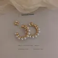Elegant French style gold hoop earrings with white pearls in fireworks-inspired design - Gold