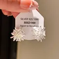 Elegant silver snowflake stud earrings with sparkling cubic zirconia on display card - Star Zirconia Style (71#)