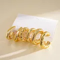 Set of 6 chunky gold-plated C-shaped hoop earrings with geometric teardrop designs. - 6-Piece Set / Gold