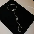 Detailed view of elegant cubic zirconia hand chain with oval sliding stone design - Bracelet - Silver