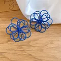 Macro detail view of blue matte spray-painted coiled wire flower stud earrings - Flower (HE34148) / Blue