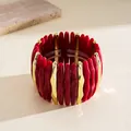 Detailed view of fashionable red marbled acrylic and gold-tone geometric stretch bracelet - Red