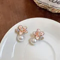 Elegant camellia flower stud earrings with large drop pearls and sparkly zircon accents - Gold-Pink