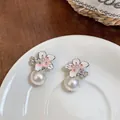 Elegant camellia flower pearl earrings with 18K gold plating and sparkling zircon detail - Silver-Pink