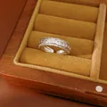 Elegant silver finish open ring with sparkling pavé cubic zirconia in a jewelry box. - Ring Style 3