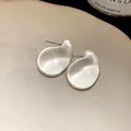 Macro view showing the transparent texture of teardrop acrylic stud earrings - Large Version / Clear