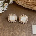 Close-up of 18k gold plated zircon flower stud earrings with elegant white center stone - Flower Cluster Shell Stud Style (4#) / Silver Needle / Gold