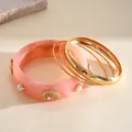 Set of 4 bangles: Pink resin cuff with faux pearls and gold shells plus thin gold rings - Gold-Pink