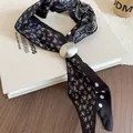 Elegant black paisley and polka dot chiffon neck scarf with a sleek silver buckle - Black Paisley