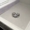 Detail view of silver-tone zircon geometric open ring with interlocking link design - Multi-layer Hollow Style / Silver
