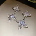 Exquisite detail of silver color earrings featuring shimmering white zircon flower charms - Silver