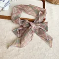 Colorful plaid chiffon neck scarf for women tied in a bow on a rustic wooden tray - Brown Stripes