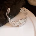 Macro view of the intricate pleated butterfly design on the silver open cuff bangle - Silver (2#)