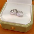 Detailed view of silver hoop earrings with pavé cubic zirconia in a velvet box - Silver
