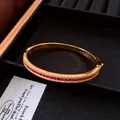 Retro palace style gold bangle with red zircon inlay on black velvet display - Bangle (HB6076) / Gold-Rose Red