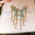 Elegant gold-plated zirconia flower earrings with blue and pink stones detail. - Gold-Blue-Pink