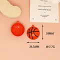 Detail view of orange basketball charm featuring 39mm length and 34.5mm width measurements - 8 Basketball