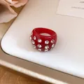 Detailed view of a stylish red chunky resin ring embedded with sparkling clear rhinestones - Ring / Red