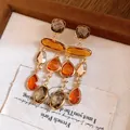 Macro view of Maillard style vintage crystal tassel earrings in warm amber tones. - Long Tassel / Silver Post Coffee Gray