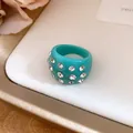 Chunky teal resin ring with sparkling rhinestones for a chic fashion statement - Ring / Cyan