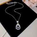 Exquisite detail shot of sparkling zircon teardrop pendant necklace with fine silver chain - Silver