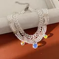 Collier multi-rangs en perles avec pendentifs en cristal irisé sur fond de cuir marron - Bracelet / Blanc