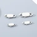 Gros plan de fermoirs à bijoux ovales en acier inoxydable poli en quatre tailles. - Largeur 9mm / Acier