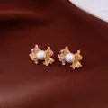 Detailed view of vintage fan-shaped earrings with gold finish, pearls, and zircons - Fan Shape Style / Gold