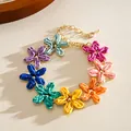 Detailed macro view of a colorful raffia flower bracelet in sweet summer style vibe - Bracelet / Colorful
