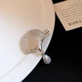 Detailed close-up showing the silver seashell texture and dangling waterdrop pearl on a hair clip - Water Drop Artificial Pearl Pendant Style / Silver