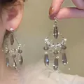 Detail shot of bohemian gray water-drop tassel earrings with vintage refined design - Tassel Water Drop / Silver-Grey