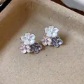 Close-up detail of enamel flower stud earrings with white, pink and blue petals - Silver Needle Silver Style / Colorful