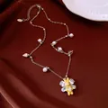 Detailed view of a yellow rabbit pendant necklace with pearls and zircon wings - Necklace-Silver-Yellow