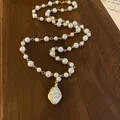 Detailed view of vintage Baroque imitation pearl necklace with irregular gold-tone pendant - Baroque Pearl Pendant