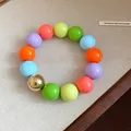 Detailed view of a vibrant colorful beaded bracelet featuring oversized round geometric beads - Bracelet / Colorful
